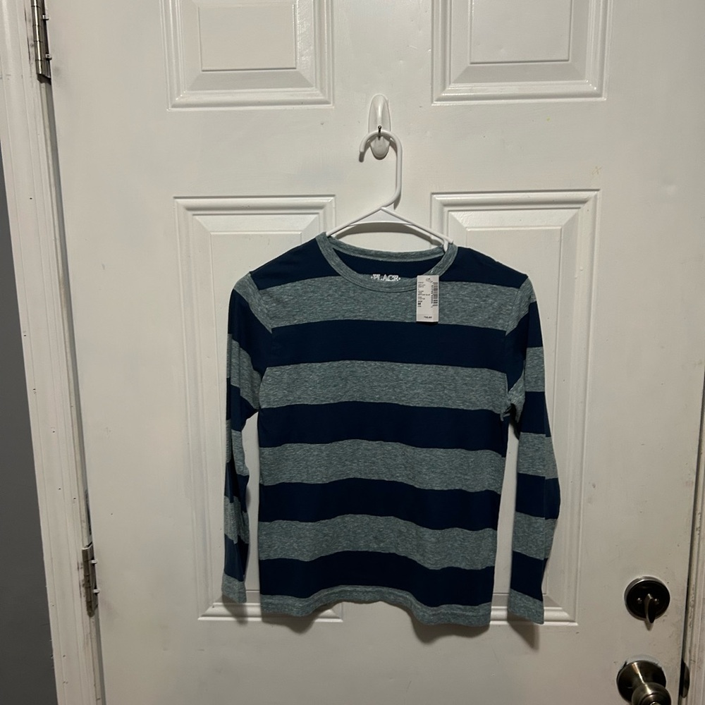 4 shirts in total. Two new two gently used long sleeve
